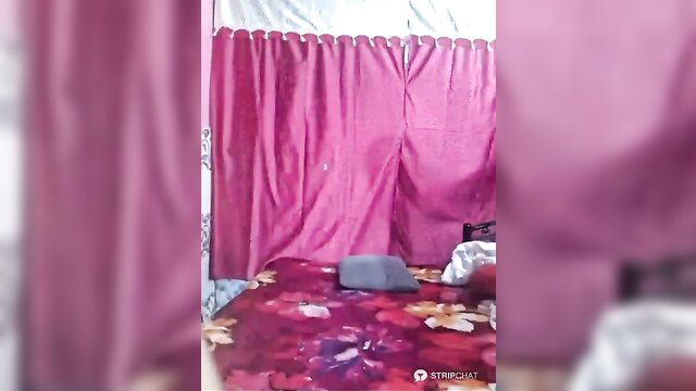 Indian SC Garima on red bed with pink curtains, sexy bedroom tease