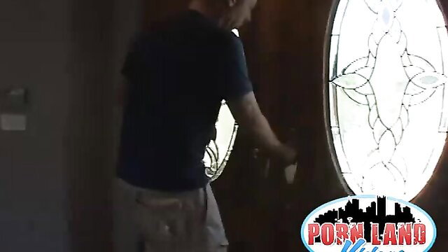 Busty beauty in tight tee and shorts by stained glass window