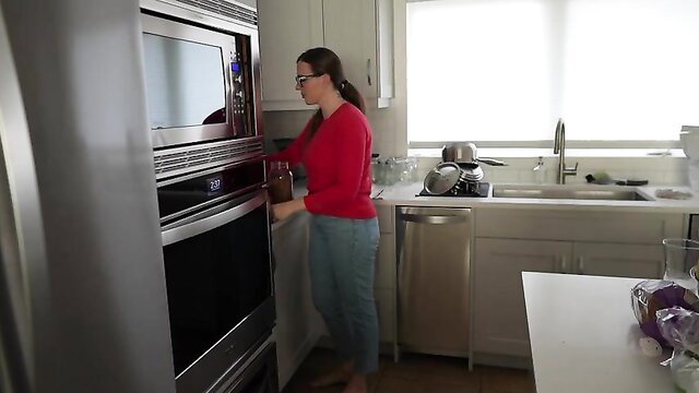 Yogabella in tight jeans and red top in kitchen, Taboo Family movie