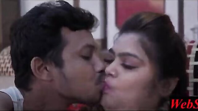 Indian couple passionately kissing in village reunion scene