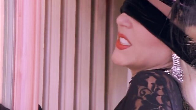 Julie Ann More in blindfold and lace dress, seductive vintage beauty
