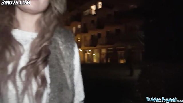 Hot Carmel Anderson smiling outdoors at night in sweater and vest