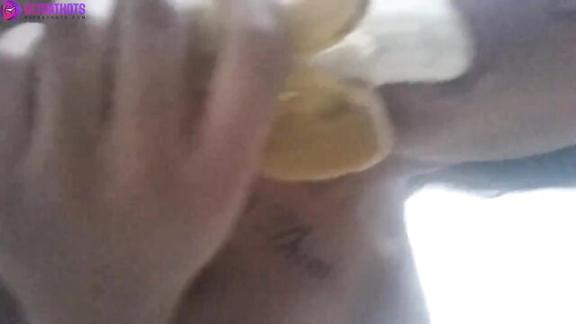 Denice Fagerberg closeup blowjob on yellow dildo, tattooed neck