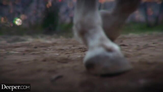 Horse hoof closeup in fiery outdoor scene from Deeper kinky threesome