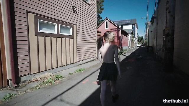Rita braless in mini skirt and stockings walking down alley