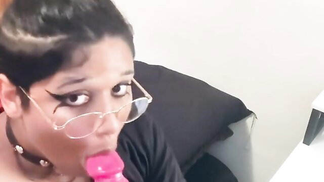 FemboyFever trans girl with glasses sucks pink dildo closeup