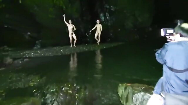 Nude Asian men dancing naked in dark cave stream at Japan Fest