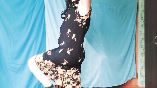 Nasty femboy in floral dress peeking around corner with teasing smile