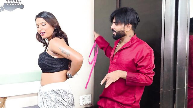 Tejashwini in black crop top and skirt, tied by desi man in red kurta