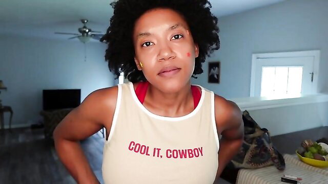 Rosaline Capulet in tank top, cool it cowboy smirk, fit black mommy