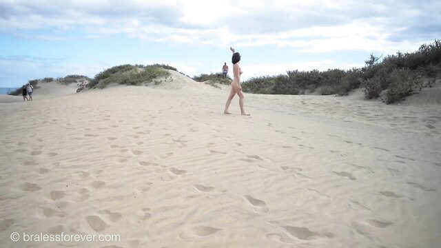 Eve Salt nude walking on sunny beach dunes, bare skin in sand