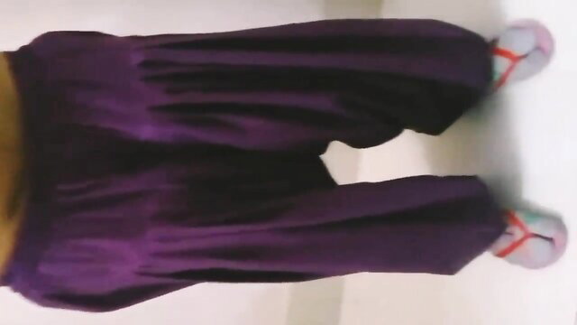 Curvy Indian Bhabhi in tight purple pants showing thick thighs and ass