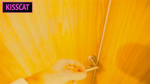 Hand holding pills on door handle in yellow room Kisscat video