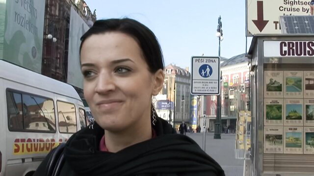 Martina the Virgin smiling on street in black top, public tease