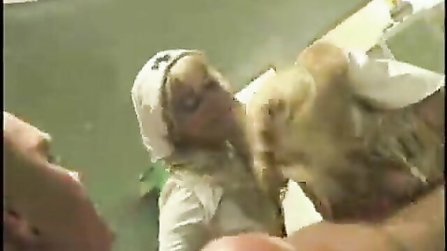 Silvia Lancome as evil nurse fellating in hazmat suit closeup