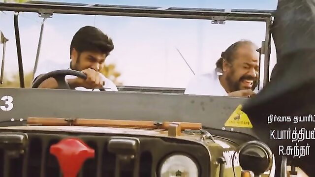 Two Tamil men smiling in Jeep from hot Indian movie K Parthiban R Sundar