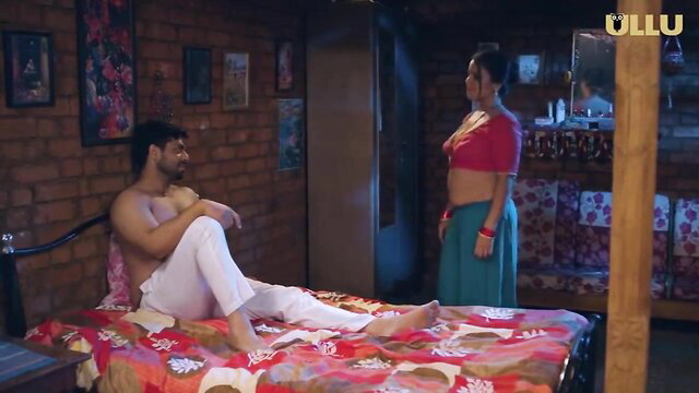 Desi Indian bhabhi in red blouse green saree with shirtless hunk on bed