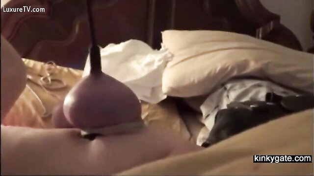 Amateur BDSM babe enduring intense pain with purple enema bulb insertion