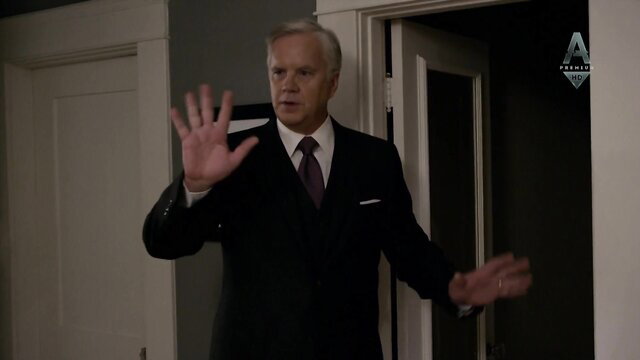 William Hurt in suit gesturing in The Brink s01e02-03 scene with Carla Gugino