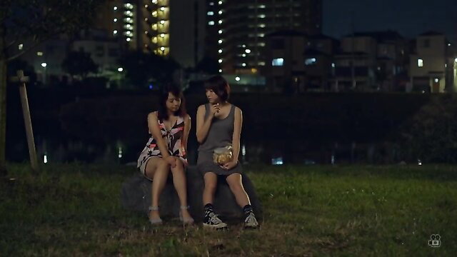 Yumi Anno and friend in sexy dresses sitting outdoors at night, JAV celebs
