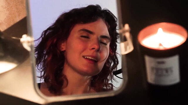 Russian 18yo with thick natural tits smiles in mirror by candlelight