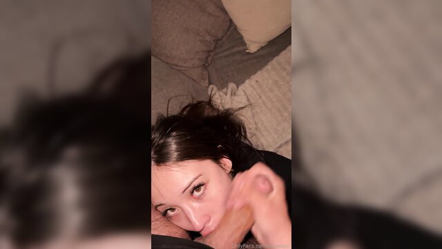 MewSlut lying in bed sucking cock closeup during movie night BJ