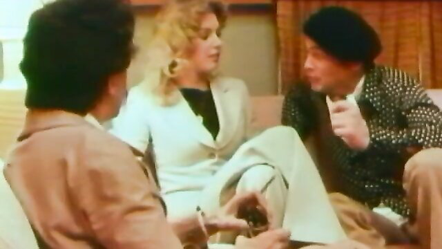 Vintage 1975 threesome: blonde with two men chatting intimately