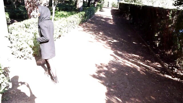 Mystery woman in hoodie walks risky path in Barcelona public park