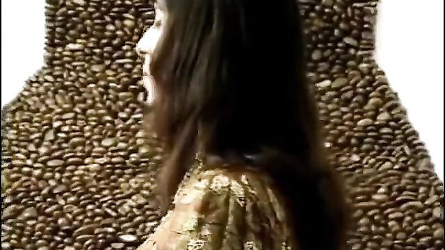 Indian bewitched ladyboy in gold dress surrounded by beans