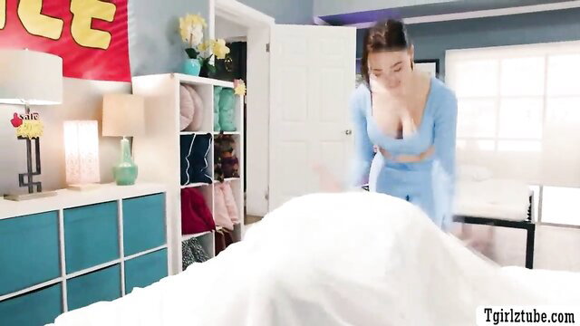 Asian TS in blue lingerie bending over bed in sales scene