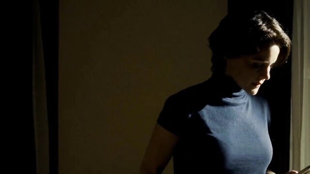 Carla Gugino in tight turtleneck, seductive profile view