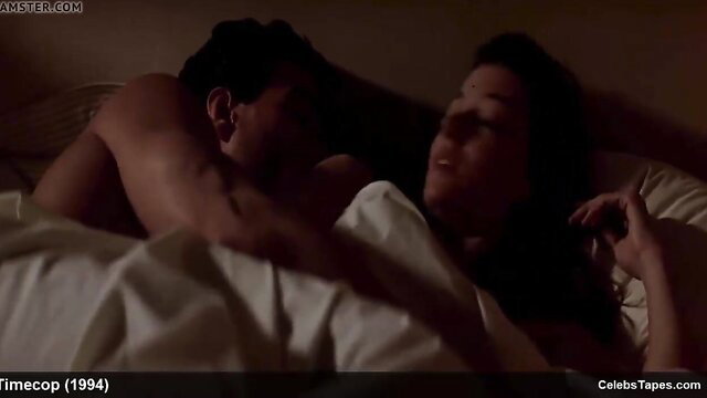 Mia Sara and Laura Murdoch nude in bed embracing intimately