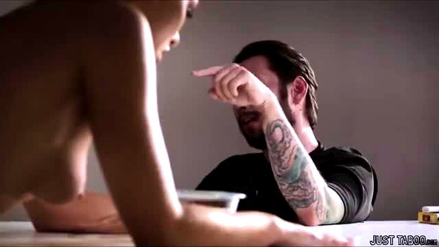 Asian nude woman points at tattooed man's face in taboo inspection scene