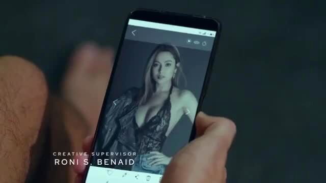 Angeli Khang in sexy black lace lingerie on phone screen, erotic TV show