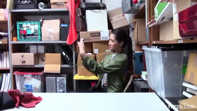 Skinny Asian Jade Noir holding box in green top ponytail