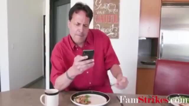 Purple Bitch as mom in red shirt checks phone at table, FamStrikes taboo