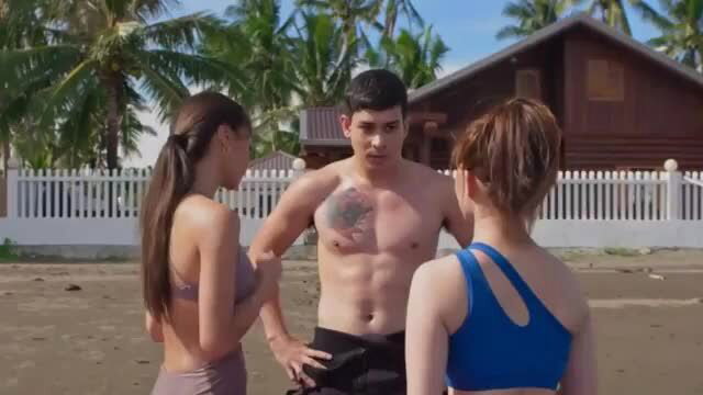 Kylie Verzosa in bikini with topless tattooed hunk in beach threesome
