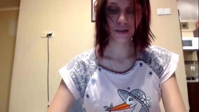 Redhead pregnant teen in cute stork shirt, closeup face contractions