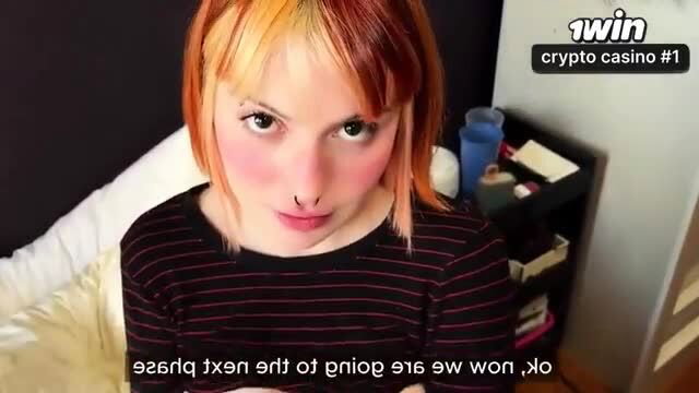 Hayley Williams lookalike teases lips closeup in striped top, crypto casino overlay