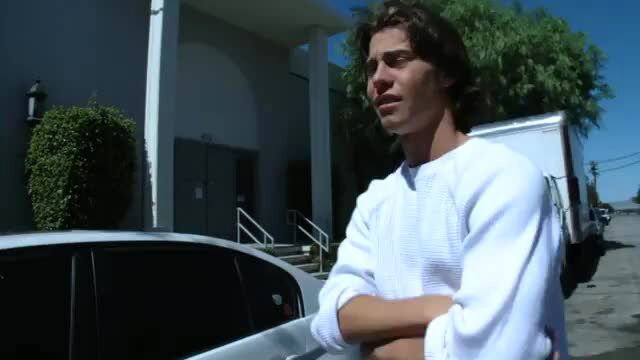 Hot guy in white sweater arms crossed outdoors, teen sex thumbnail