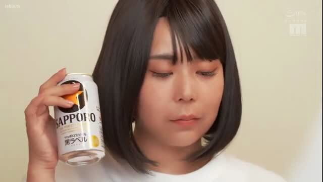 Japanese bob-cut girl holds Sapporo beer can, sexy ad pose