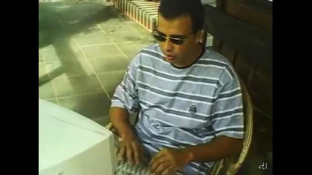 Man in sunglasses typing on keyboard outdoor, Camilla adult video thumbnail