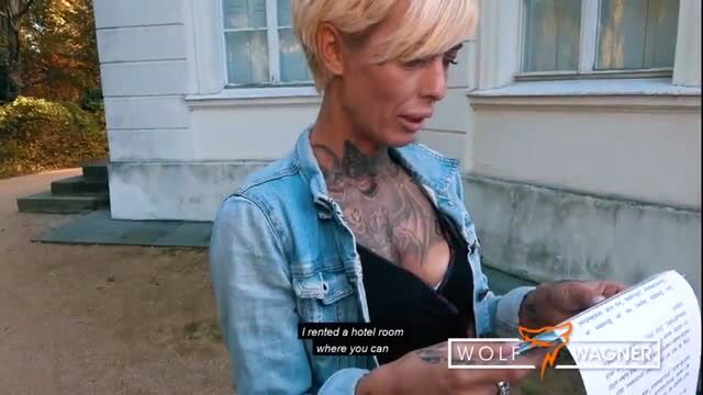 Tattooed blonde MILF Vicky Love reads note outdoors in jeans jacket