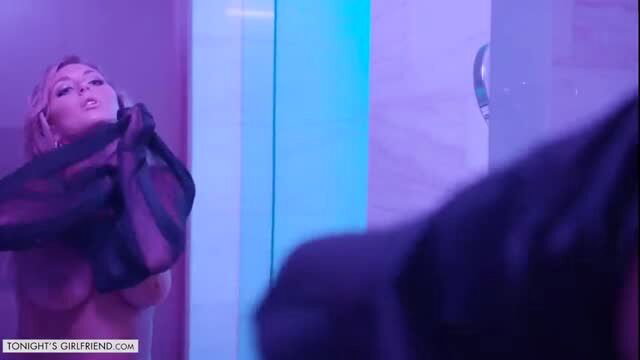 Kayley Gunner topless in sheer black lingerie under neon lights