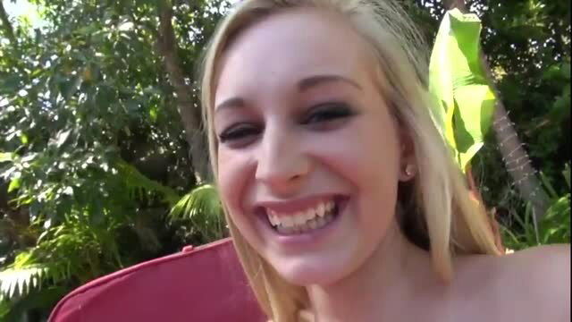 Smiling blonde stepsister enjoying sun outdoors in adult video thumbnail