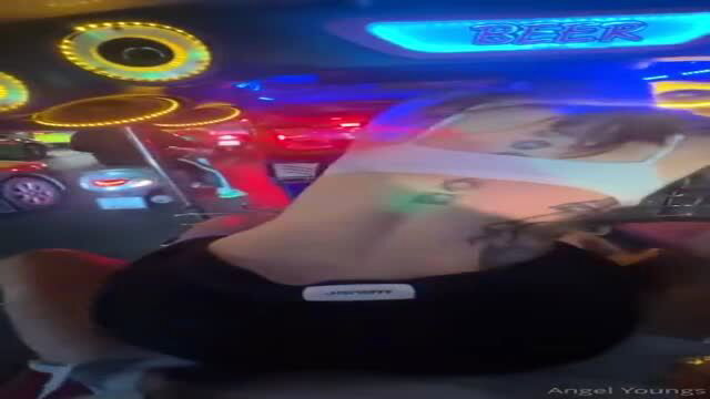 Angel Youngs in revealing top, neon bar setting, Thailand travel vlog thumbnail