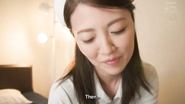 Asian mature woman in nurse top smiling close-up POV tease