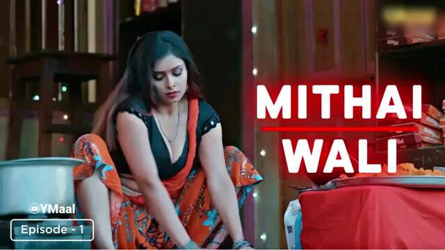 Indian Temptress in skimpy orange saree, deep cleavage tease