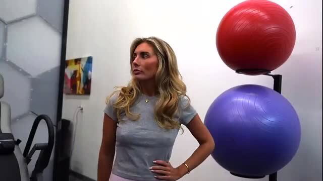Blonde cheating wife Bonnie in tight gym top & shorts by exercise balls