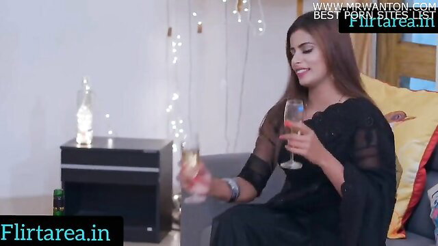 Indian beauty in sheer black dress toasts champagne seductively